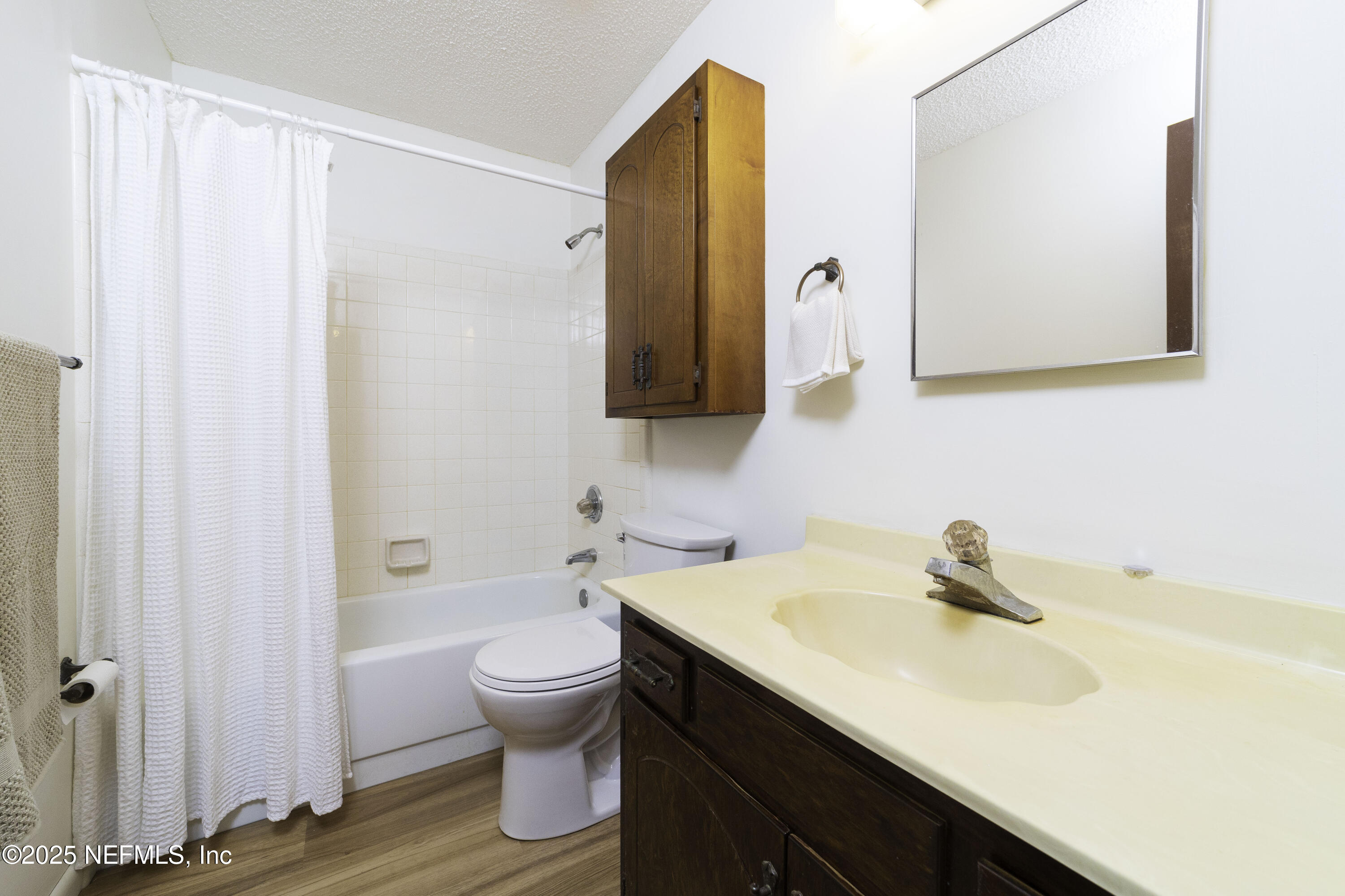 103 Indian Mound Road Satsuma, FL 32189 - Photo 26 of 36 a bathroom with a sink a toilet and a mirror