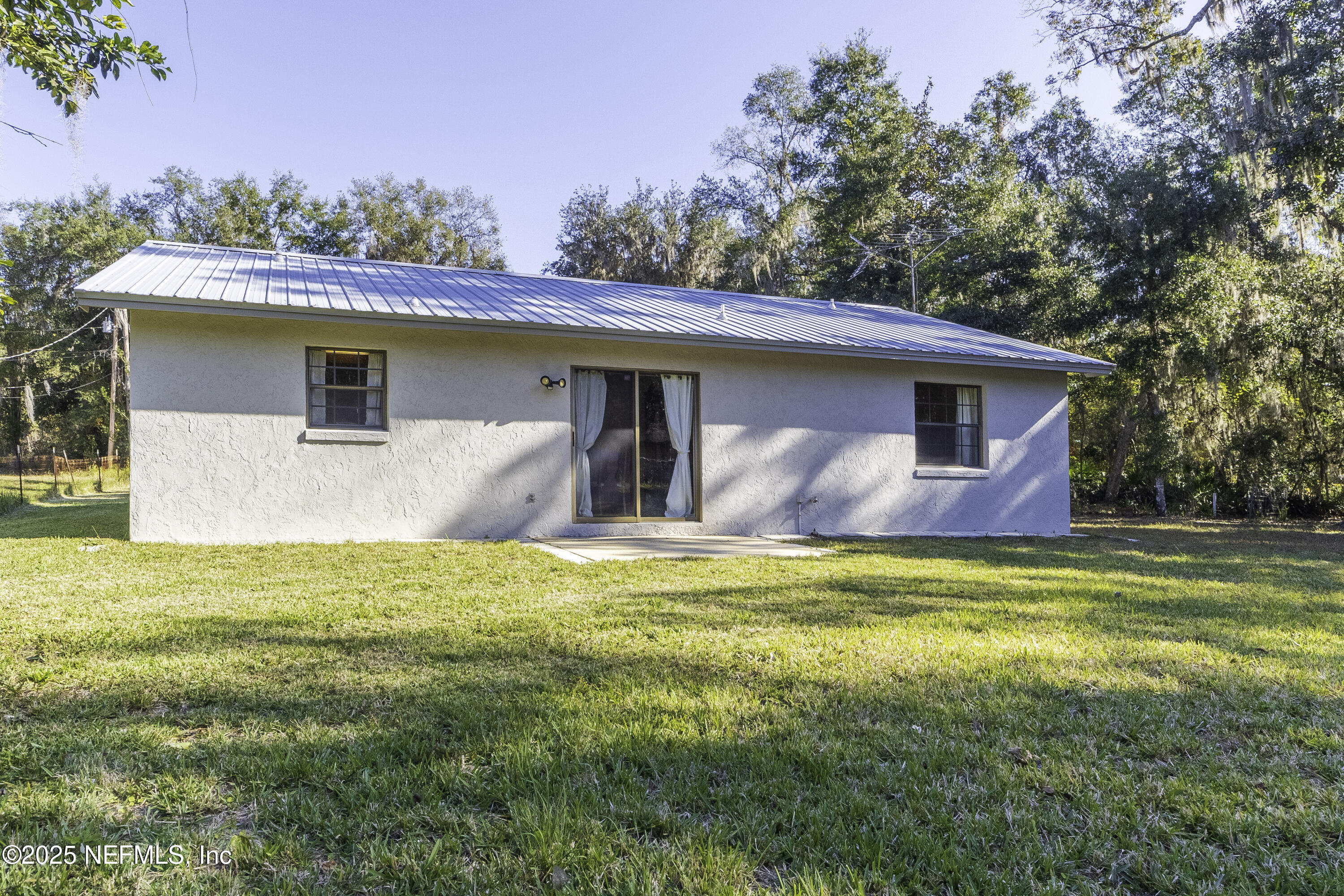 103 Indian Mound Road Satsuma, FL 32189 - Photo 29 of 36 a view of a house with a yard and a large tree
