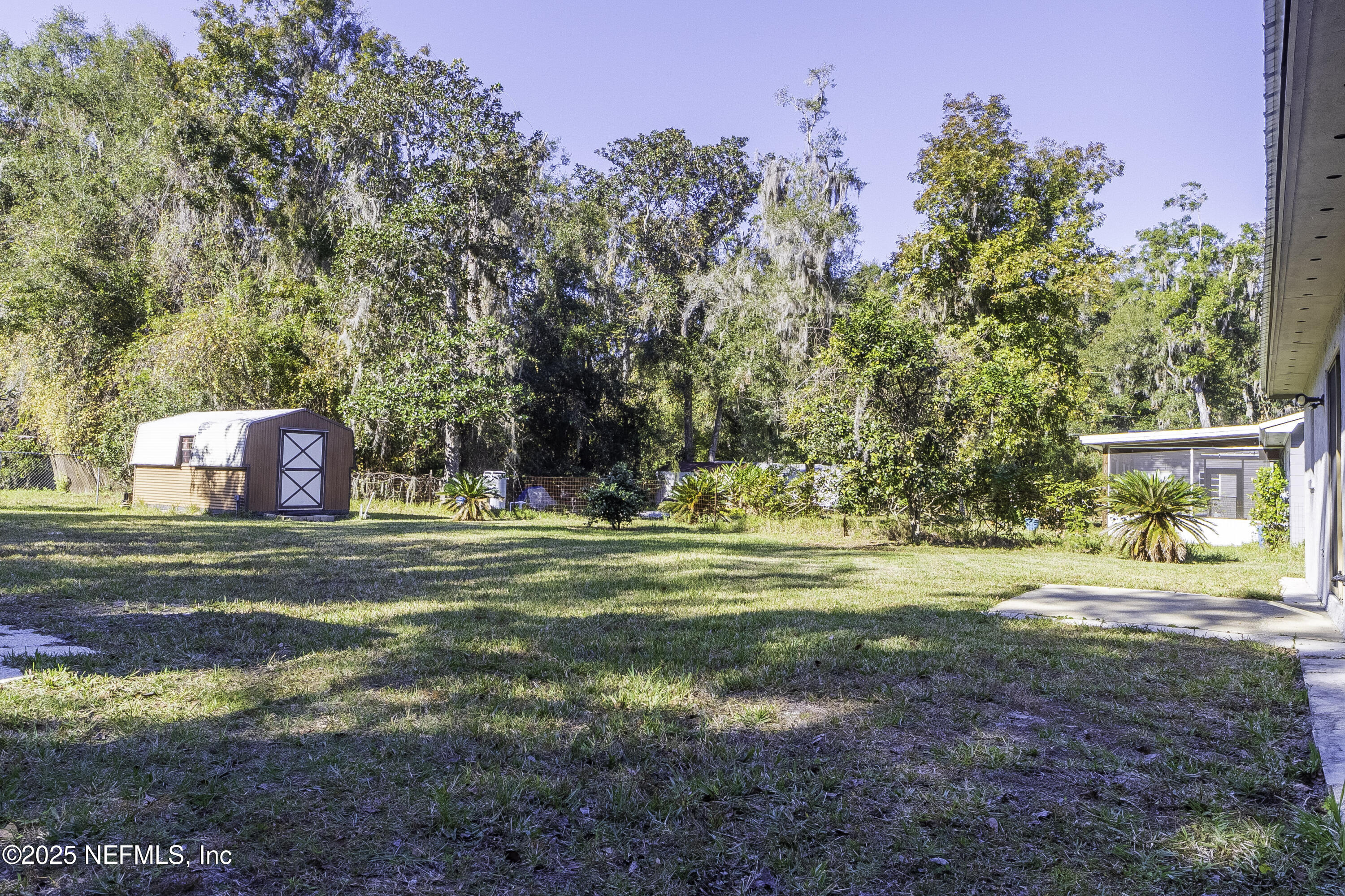 103 Indian Mound Road Satsuma, FL 32189 - Photo 31 of 36 a front view of a house with a yard and trees