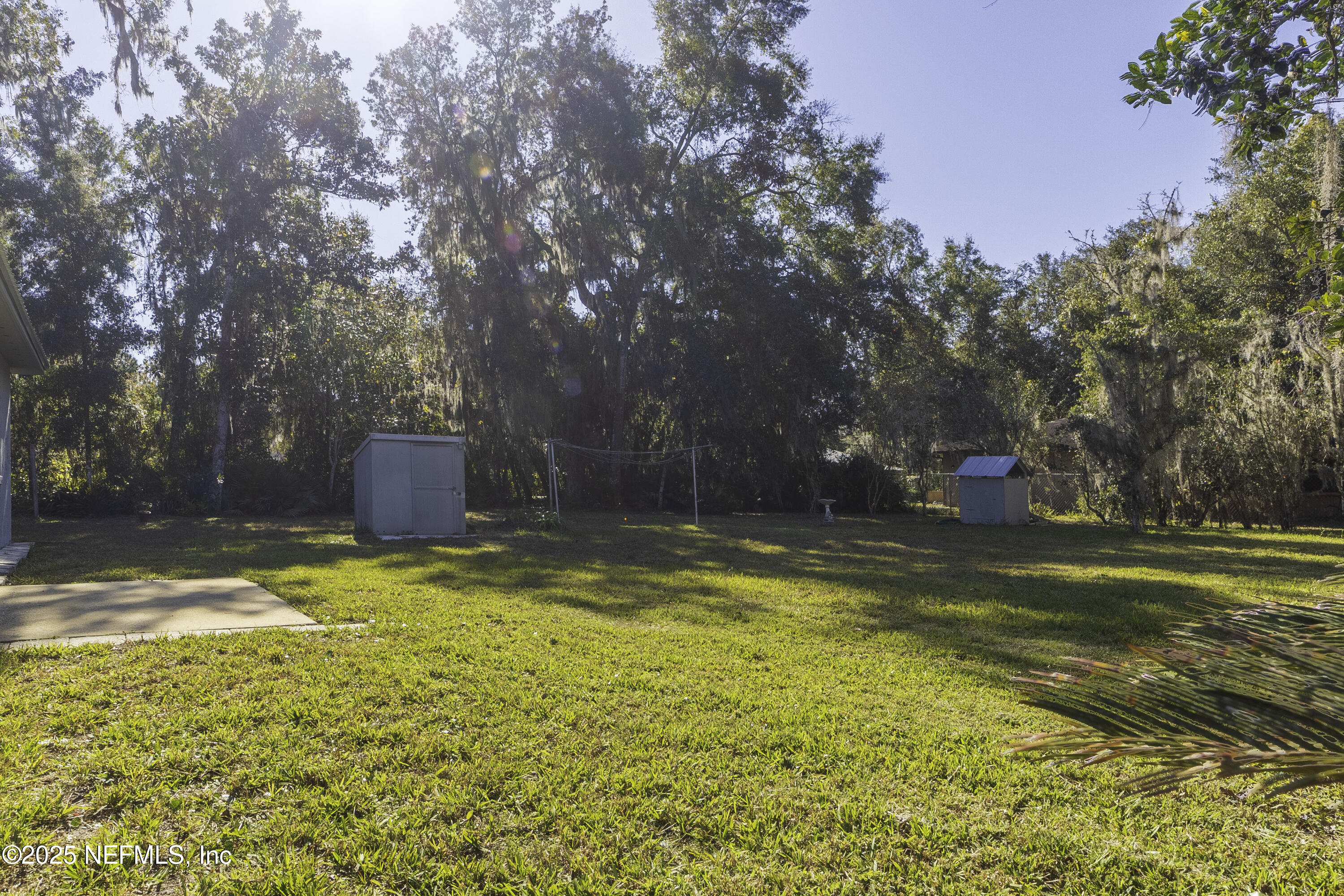 103 Indian Mound Road Satsuma, FL 32189 - Photo 32 of 36 a view of a swimming pool with an outdoor space and seating area