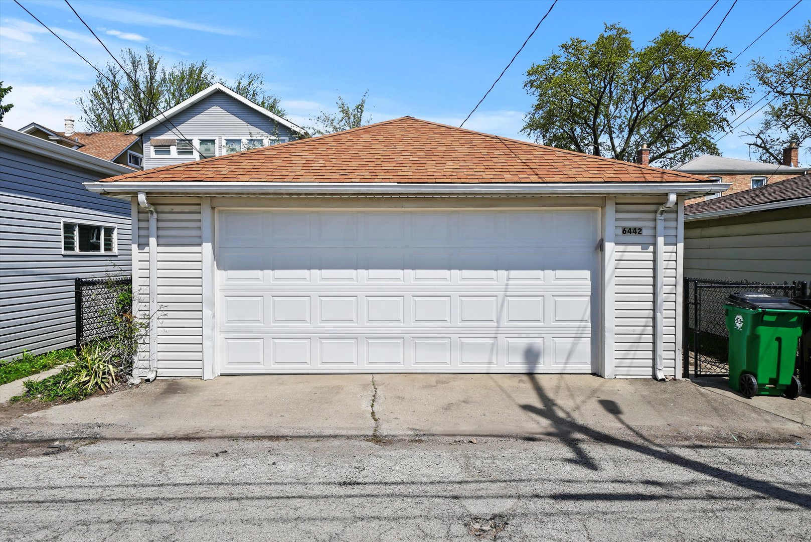 6442 27th Street Berwyn, IL 60402 - Photo 23 of 30 a front view of a house with a yard and garage