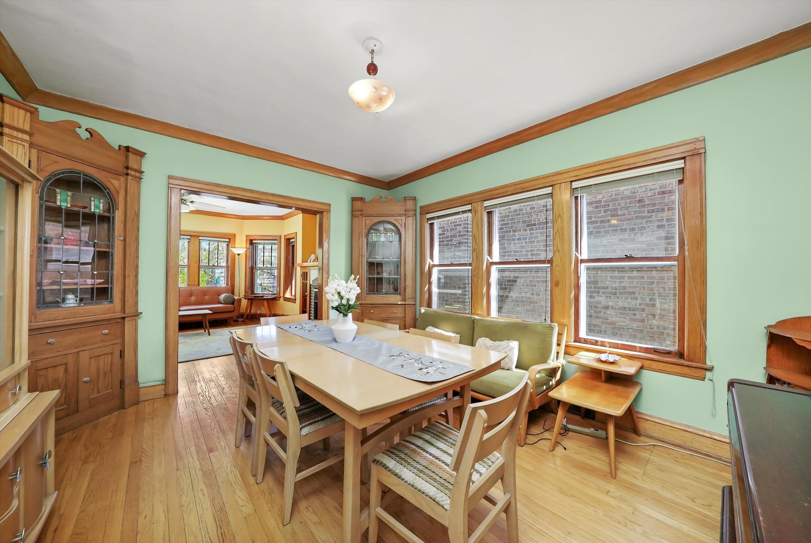 6442 27th Street Berwyn, IL 60402 - Photo 7 of 30 a view of a dining room with furniture window and wooden floor