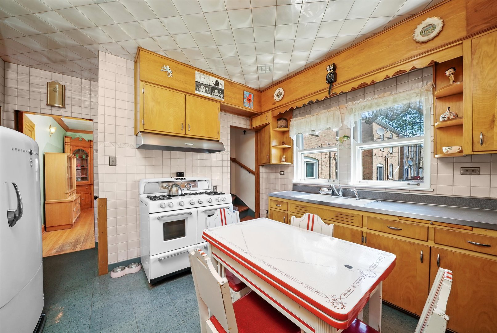 6442 27th Street Berwyn, IL 60402 - Photo 10 of 30 a kitchen that has a stove and a refrigerator