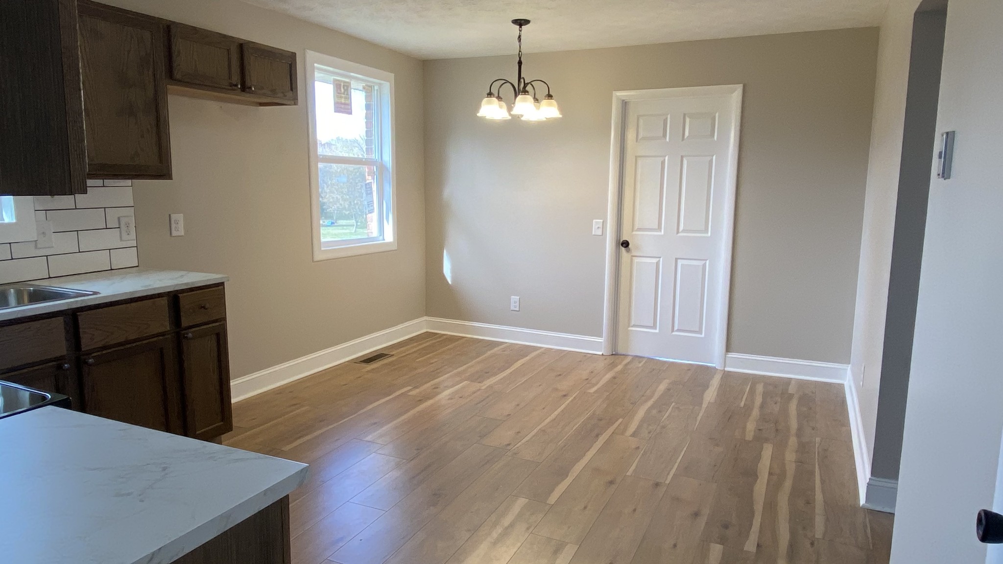 854 Jackson Road Portland, TN 37148 - Photo 4 of 11 a view of empty room with wooden floor and fan