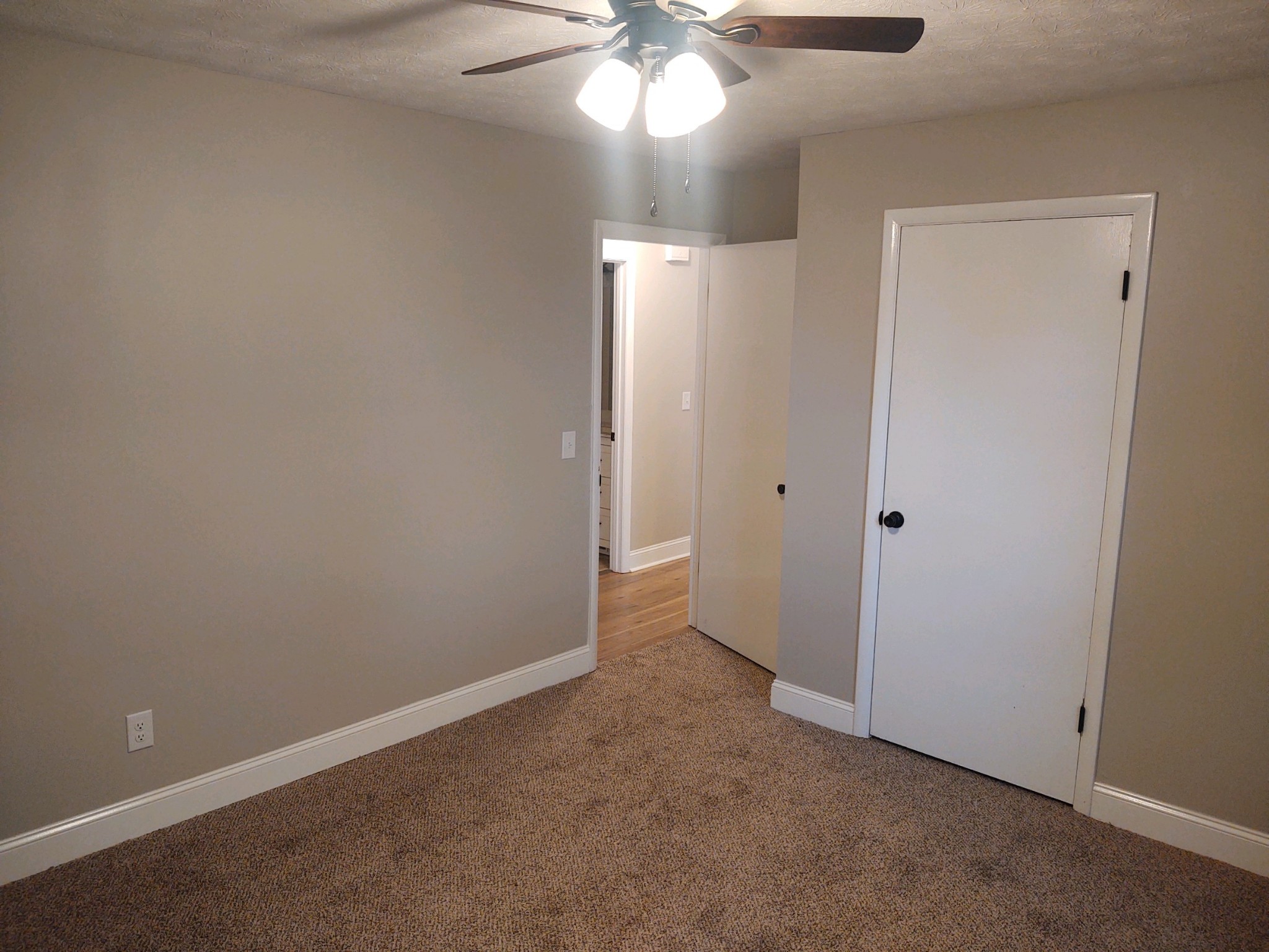 854 Jackson Road Portland, TN 37148 - Photo 6 of 11 a view of an empty room with a chandelier fan