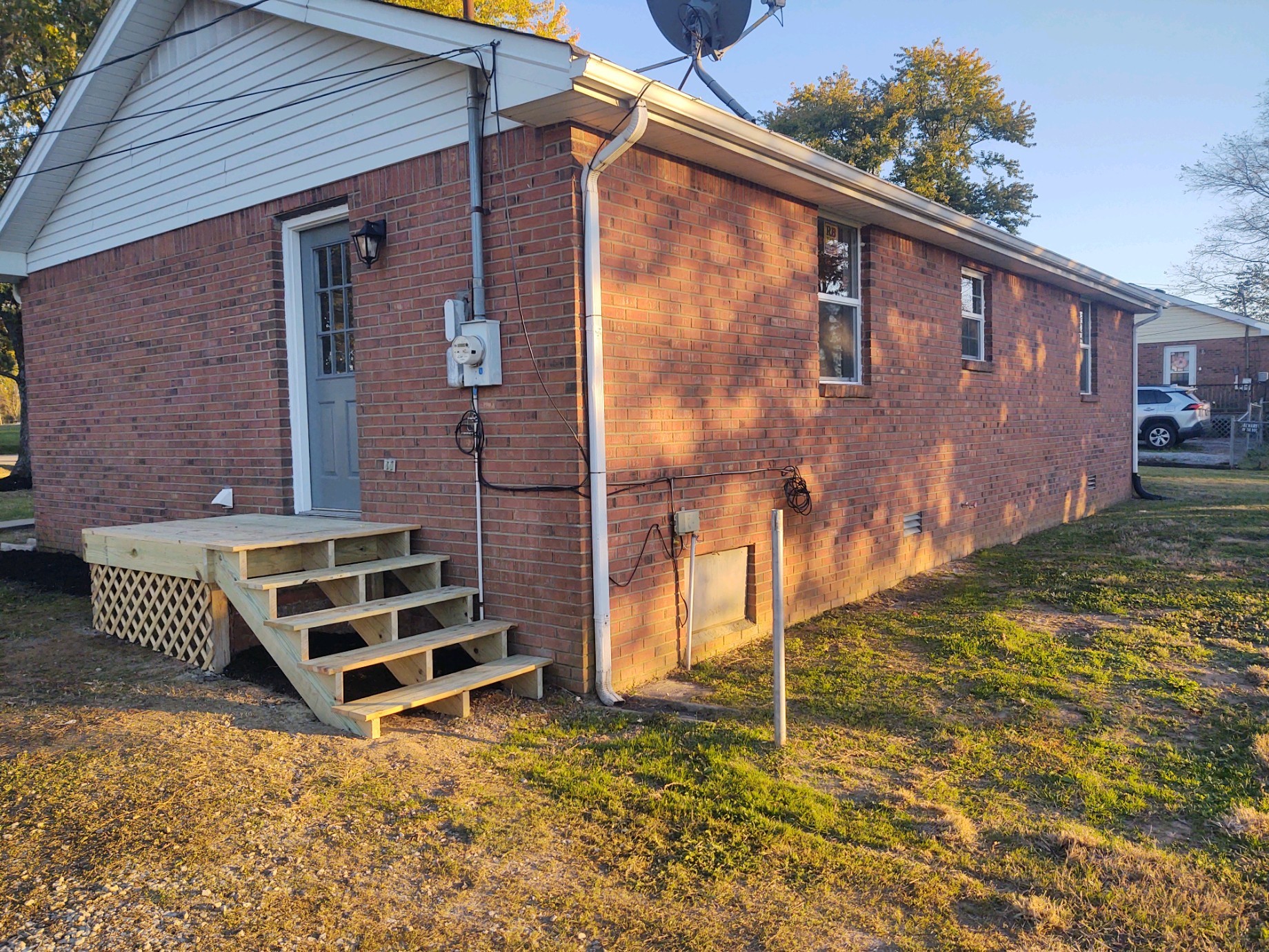 854 Jackson Road Portland, TN 37148 - Photo 10 of 11 a backyard of a house with barbeque oven and potted plants