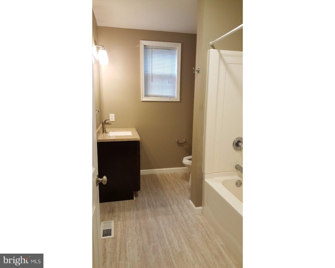 20 South Chestnut Street, Unit 1 Boyertown, PA 19512 - Photo 14 of 15 a bathroom with a sink and a mirror