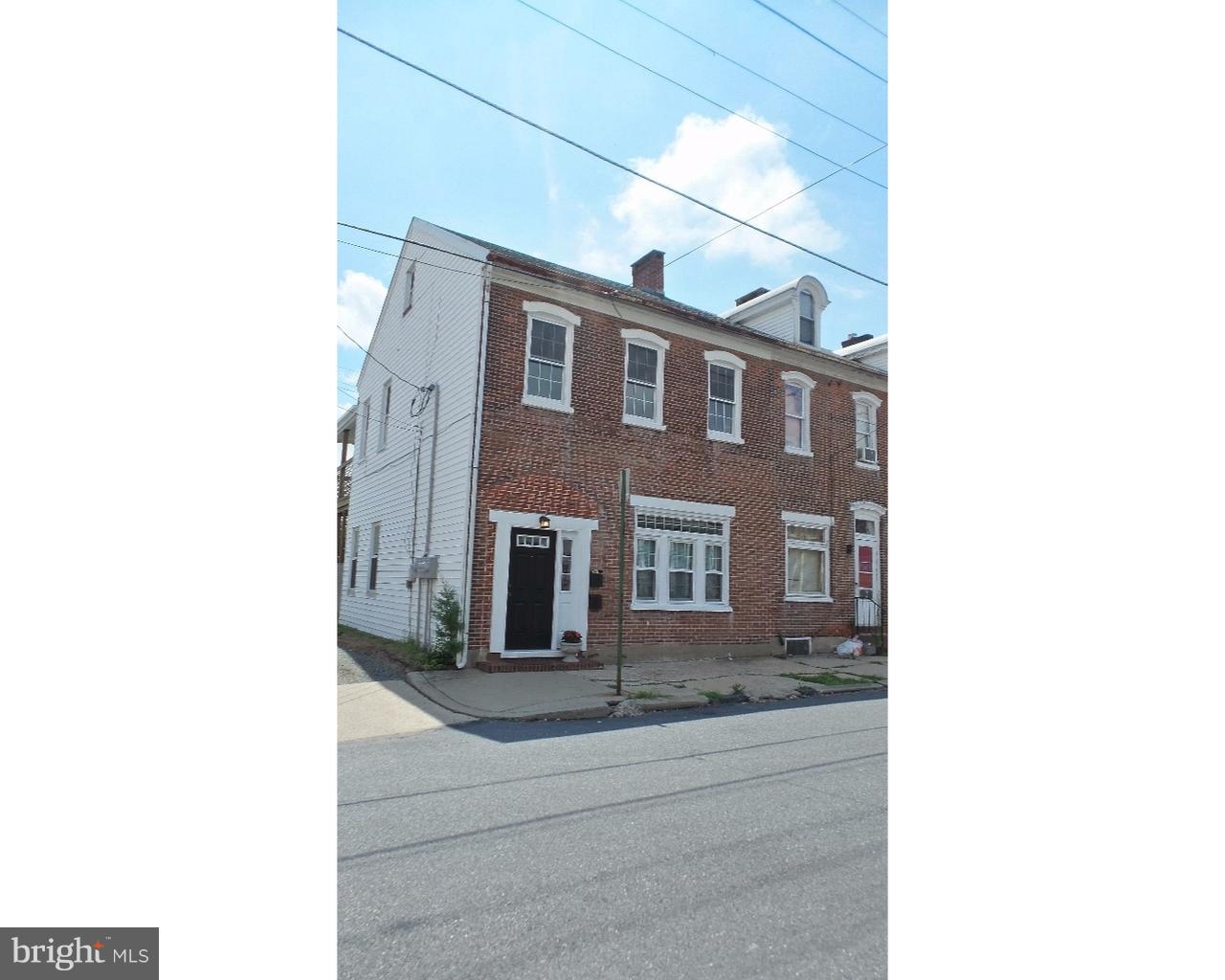 20 South Chestnut Street, Unit 1 Boyertown, PA 19512 - Photo 2 of 15 a hallway with couches and a potted plant on it