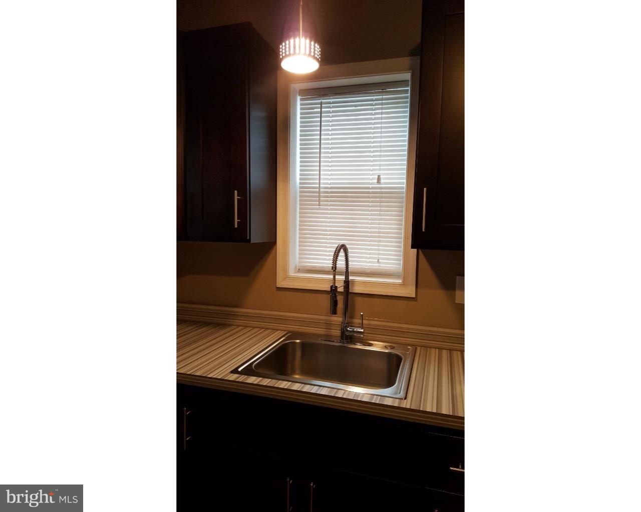 20 South Chestnut Street, Unit 1 Boyertown, PA 19512 - Photo 5 of 15 a bathroom with a sink and a mirror