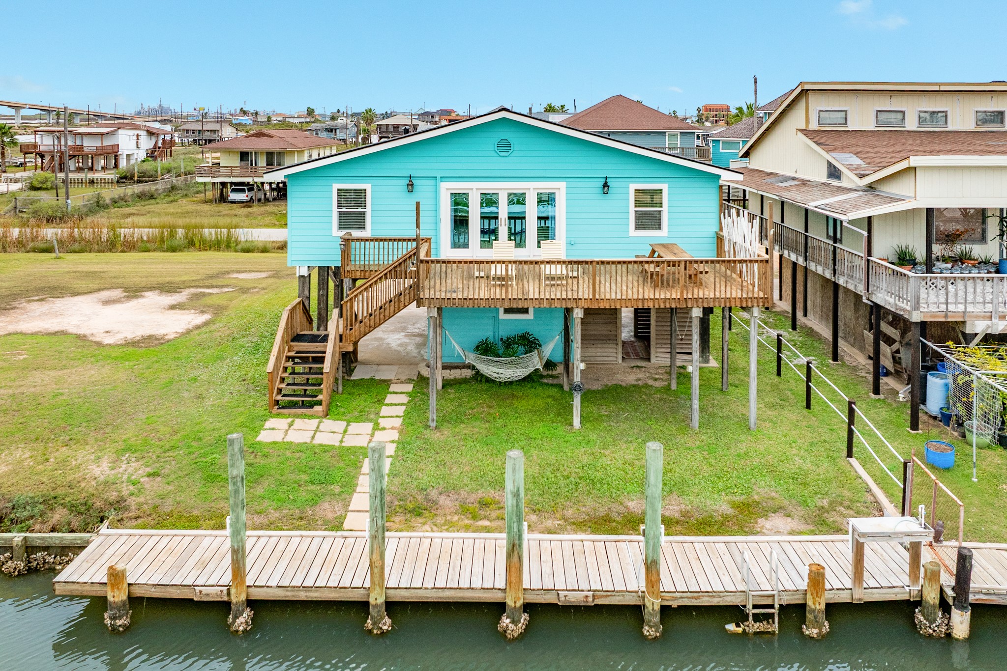306 Pompano Lane Surfside Beach, TX 77541 - Photo 1 of 37 a view of a house with a yard and sitting area