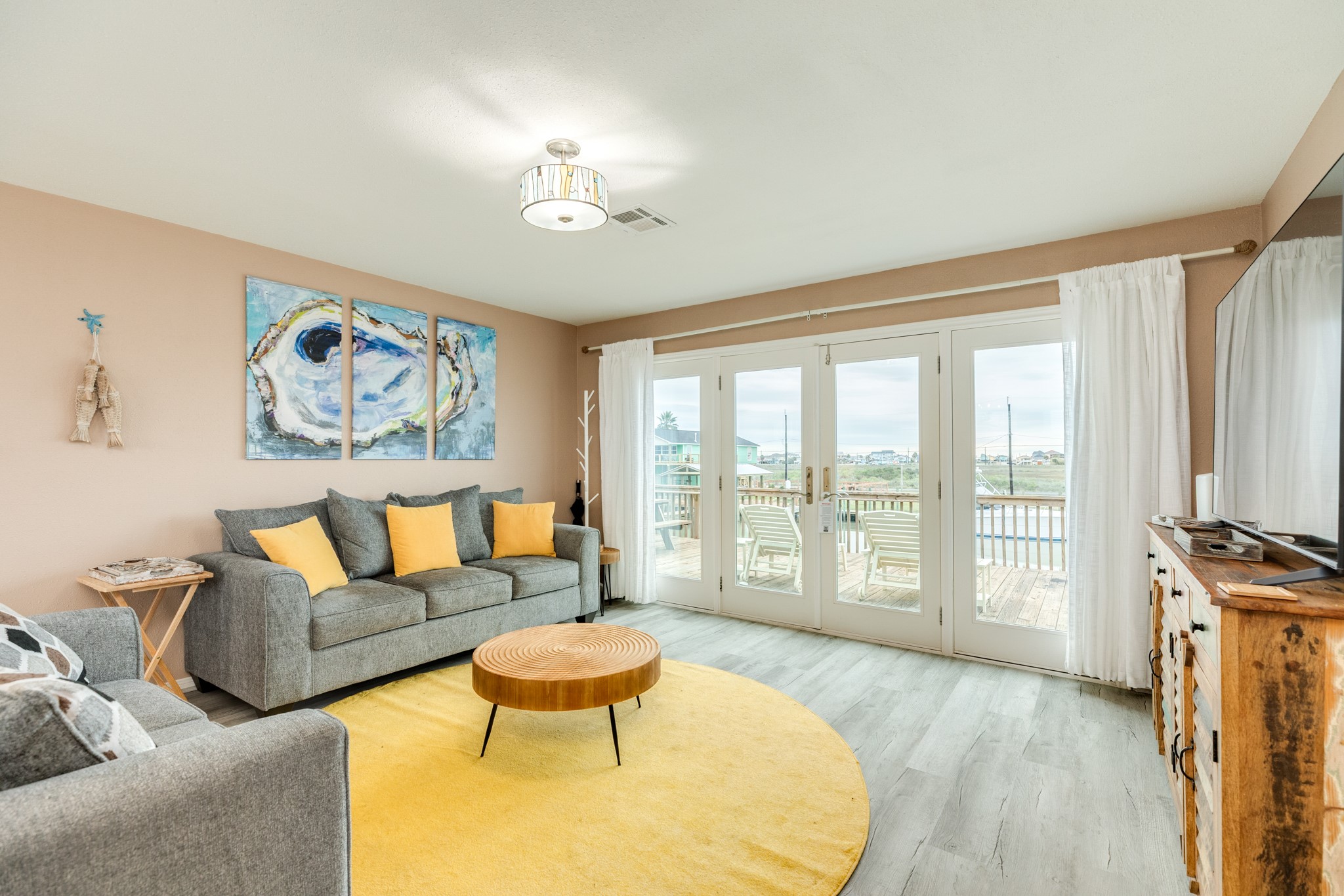 306 Pompano Lane Surfside Beach, TX 77541 - Photo 14 of 37 a living room with furniture and a large window