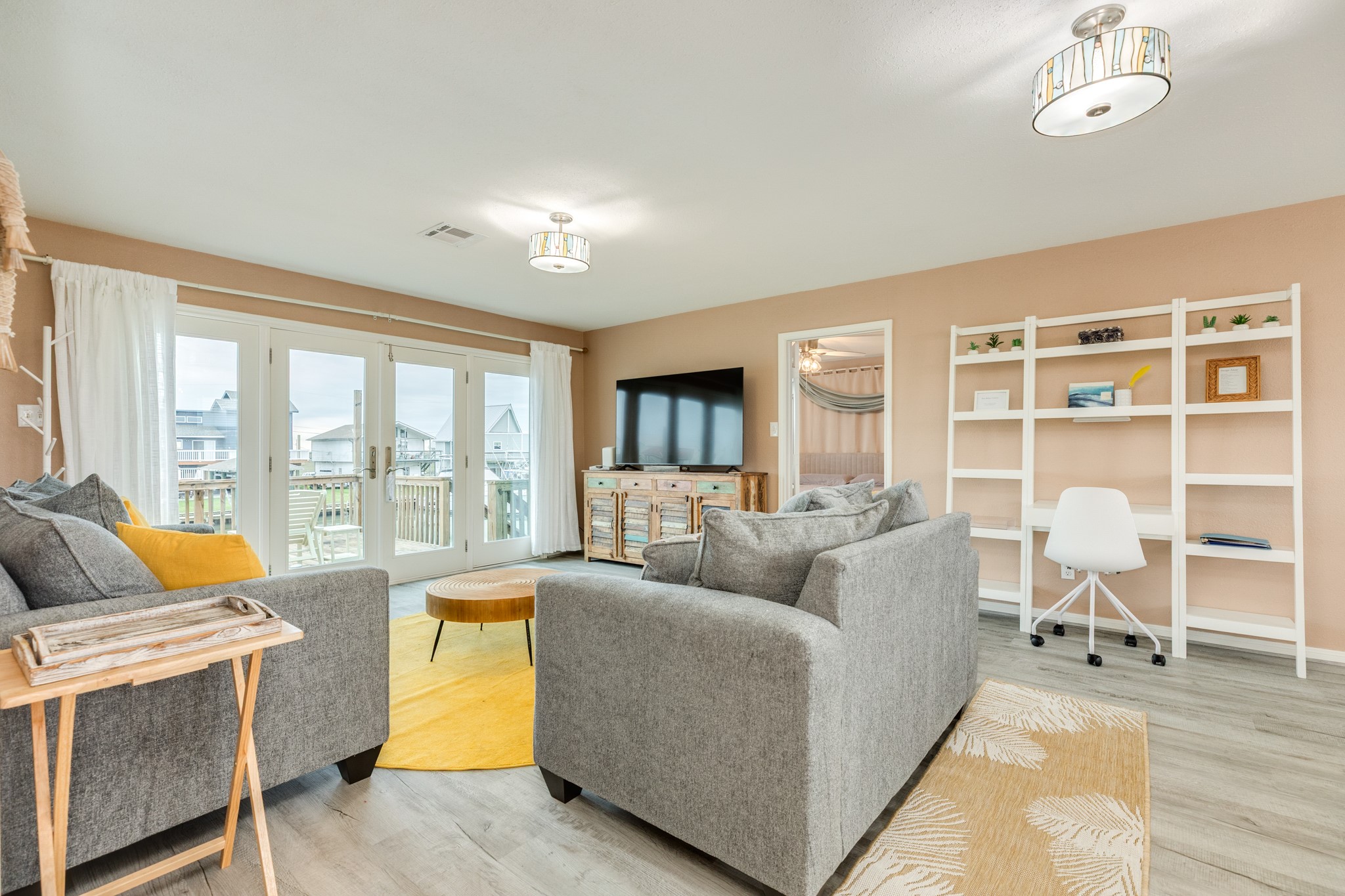 306 Pompano Lane Surfside Beach, TX 77541 - Photo 15 of 37 a living room with furniture and a floor to ceiling window