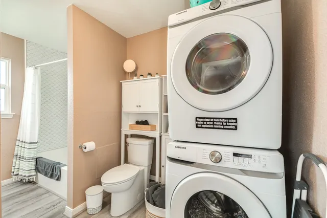 a view of a bathroom with a washer and dryer