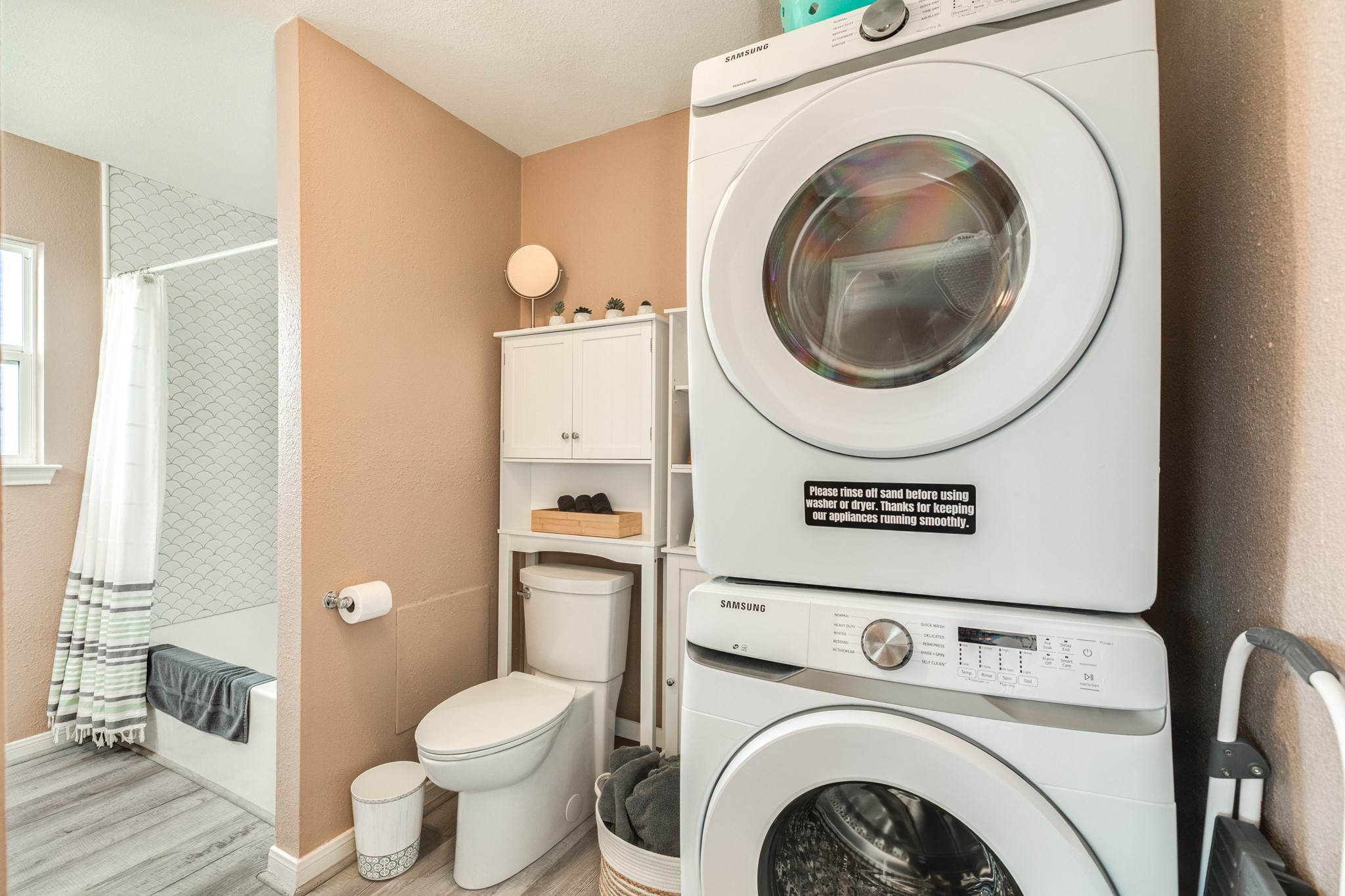 306 Pompano Lane Surfside Beach, TX 77541 - Photo 24 of 37 a view of a bathroom with a washer and dryer