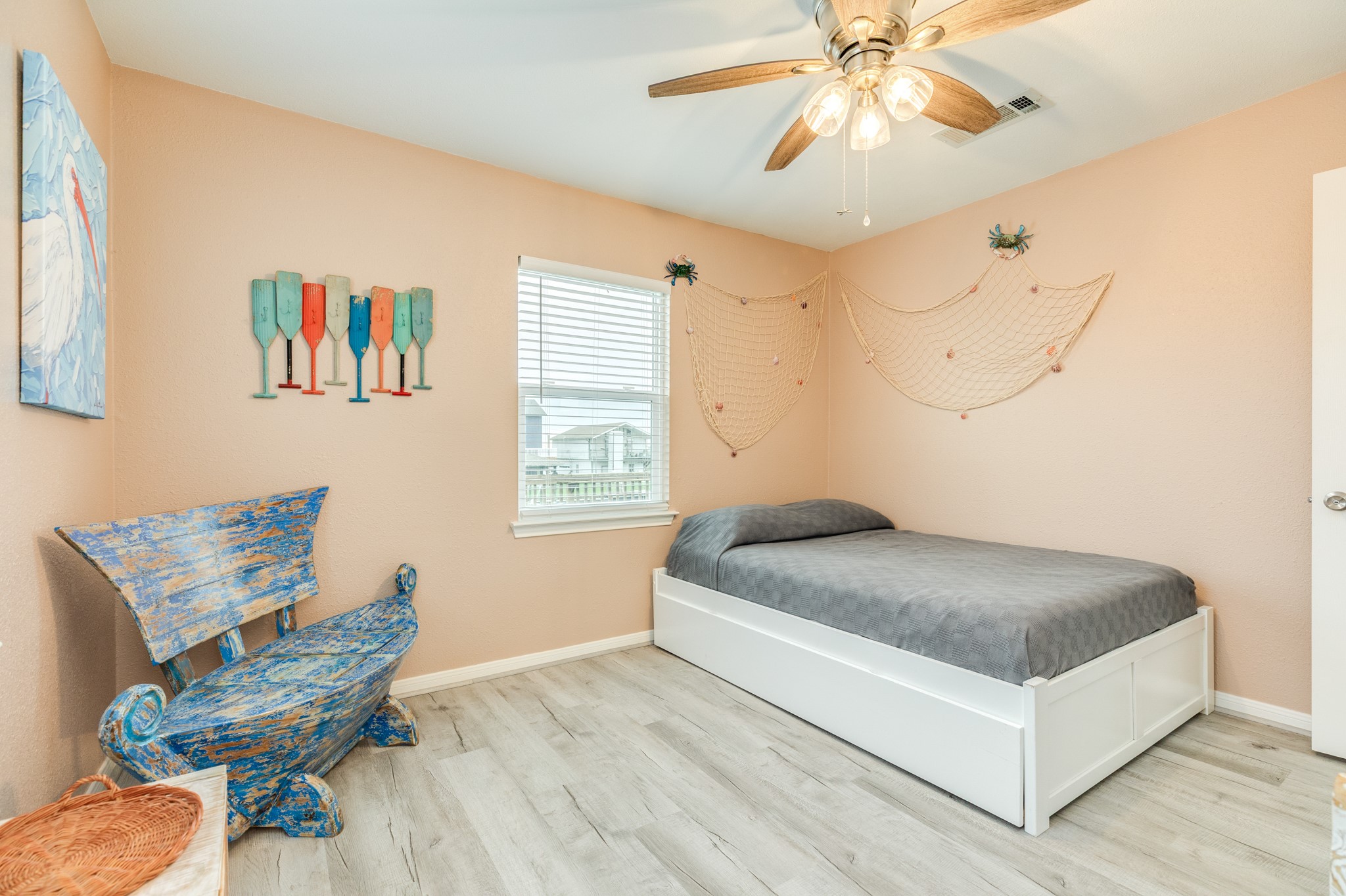 306 Pompano Lane Surfside Beach, TX 77541 - Photo 26 of 37 a bedroom with a bed and a chandelier