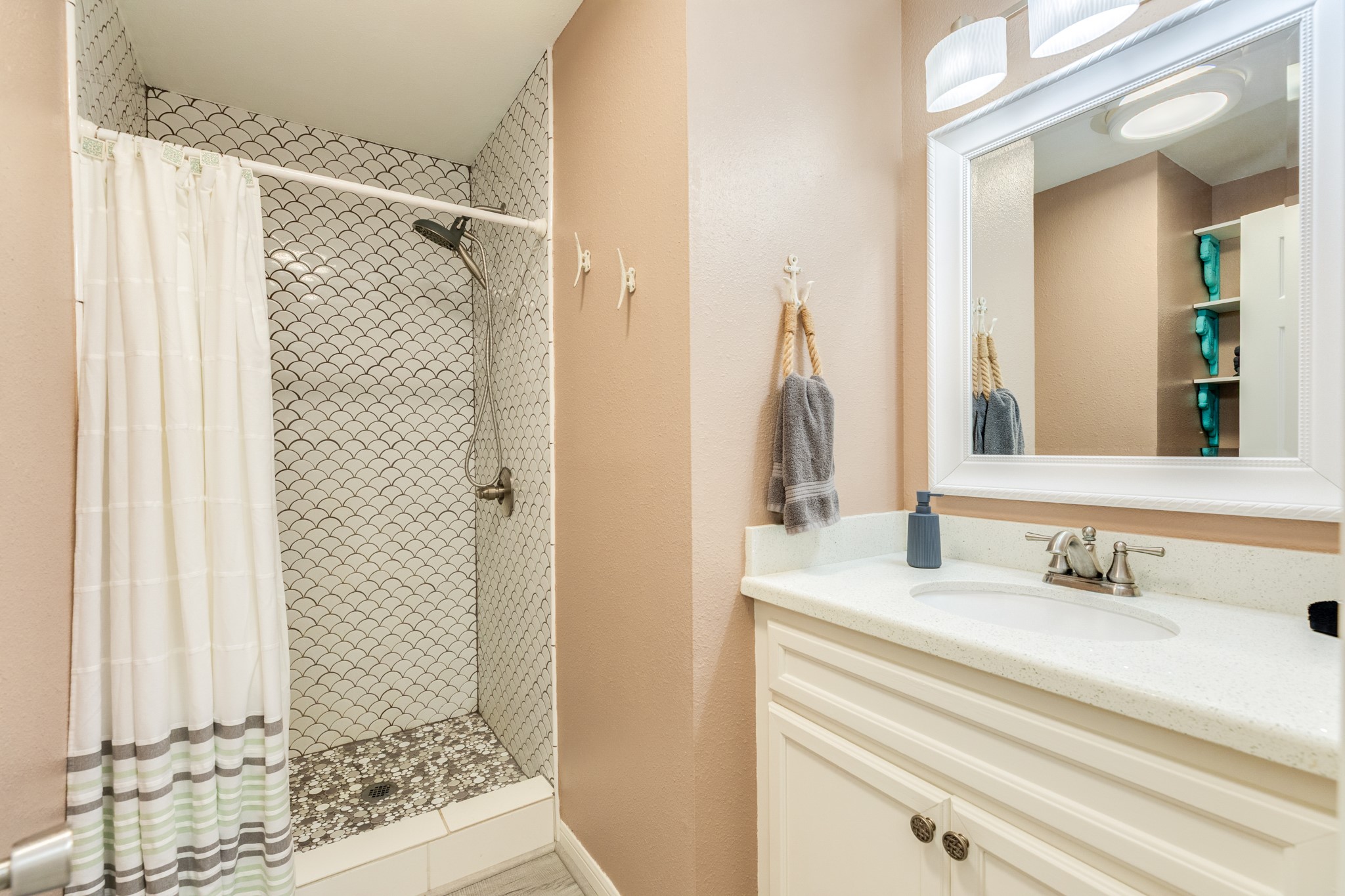 306 Pompano Lane Surfside Beach, TX 77541 - Photo 27 of 37 a bathroom with a sink and a mirror