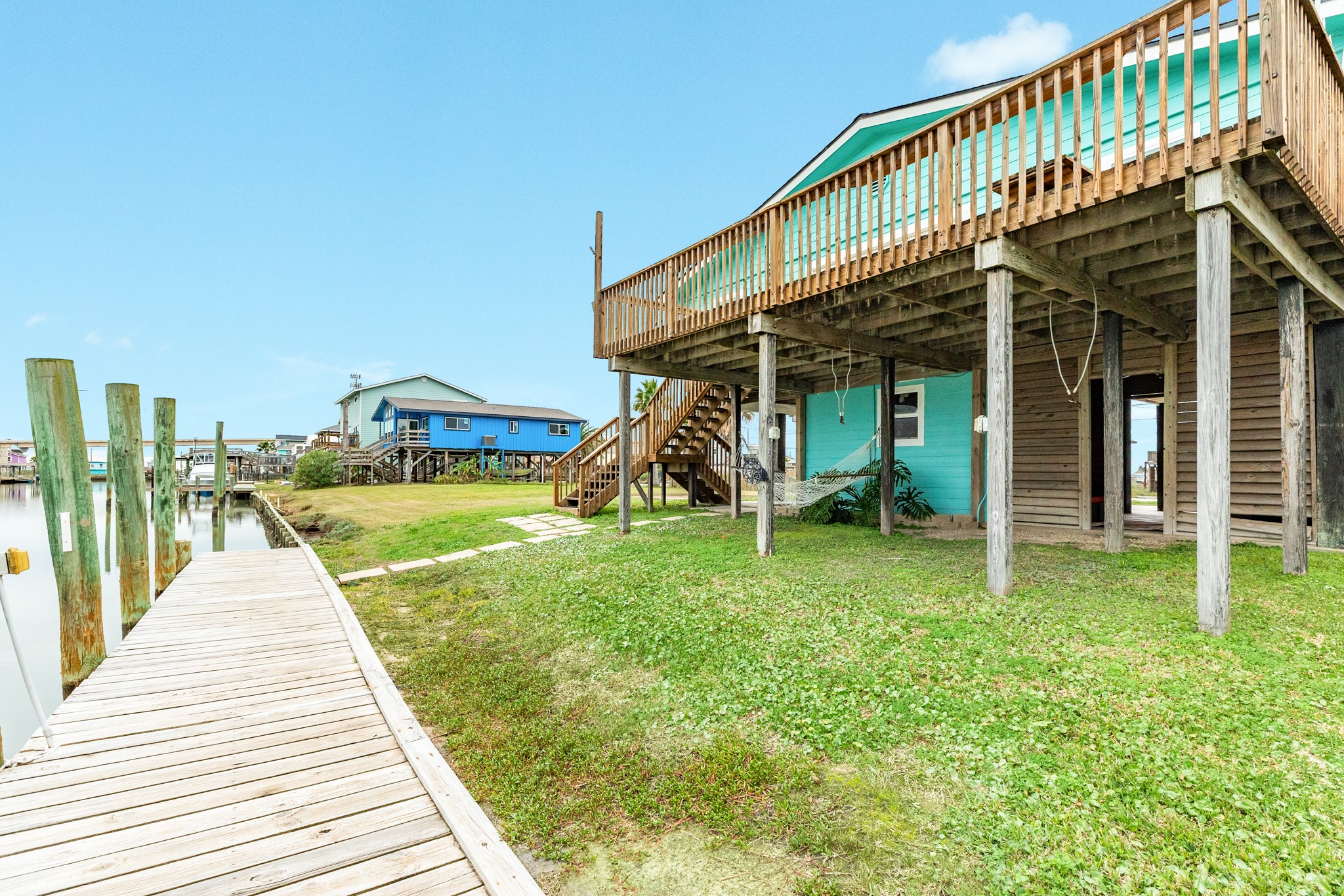 306 Pompano Lane Surfside Beach, TX 77541 - Photo 28 of 37 a view of a house with a yard