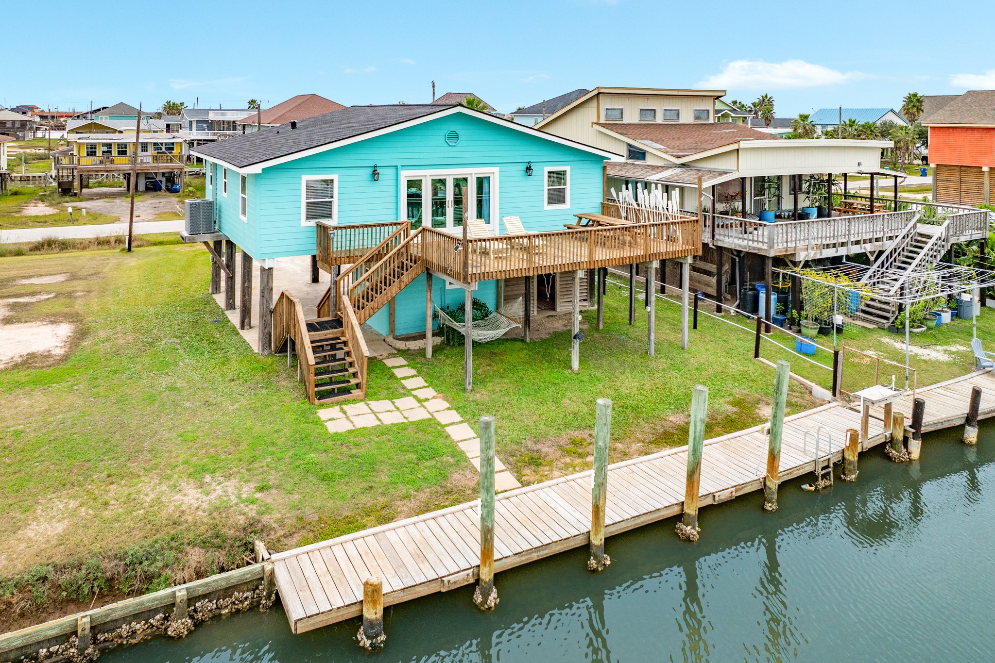 306 Pompano Lane Surfside Beach, TX 77541 - Photo 28 of 37 a view of a house with a yard