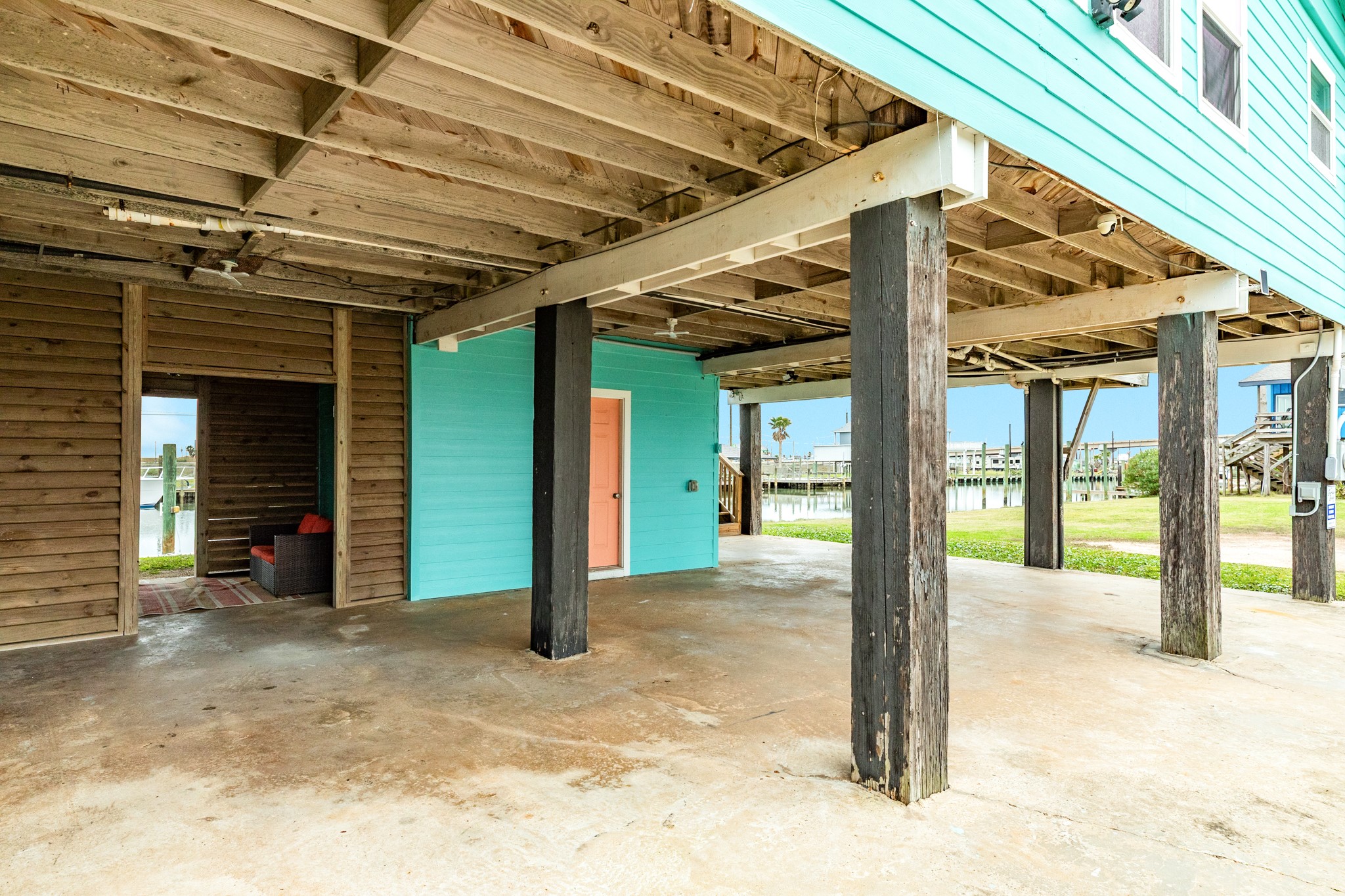 306 Pompano Lane Surfside Beach, TX 77541 - Photo 30 of 37 a view of a room with wooden roof and a table