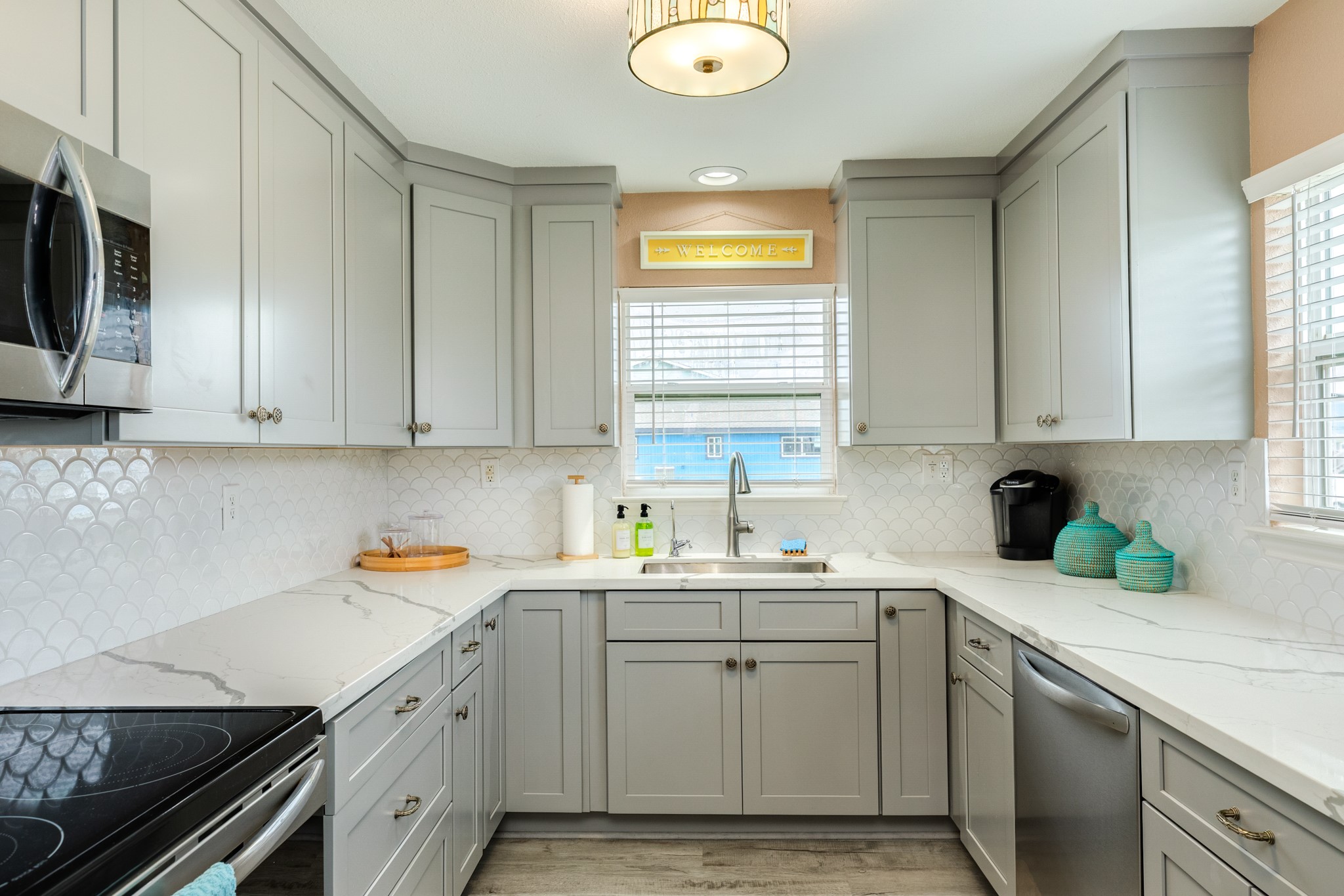 306 Pompano Lane Surfside Beach, TX 77541 - Photo 6 of 37 a kitchen with stainless steel appliances granite countertop a sink a stove and cabinets