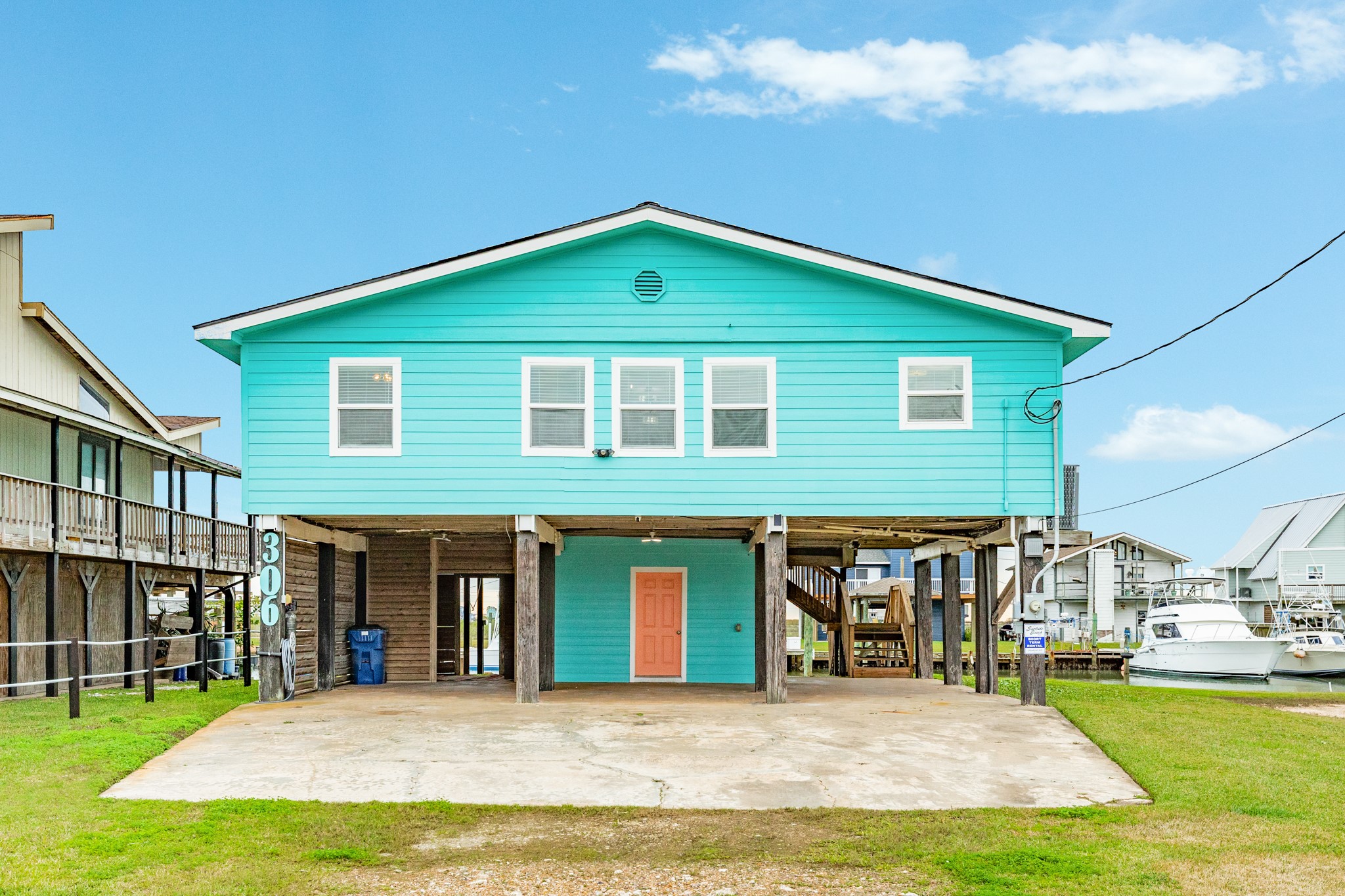 306 Pompano Lane Surfside Beach, TX 77541 - Photo 8 of 37 a view of a house with pool and a yard