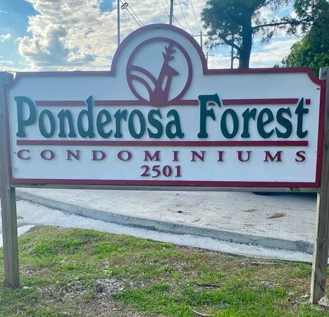 a front view of a retail shop and a street sign