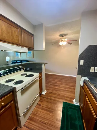 a kitchen that has a sink and a stove
