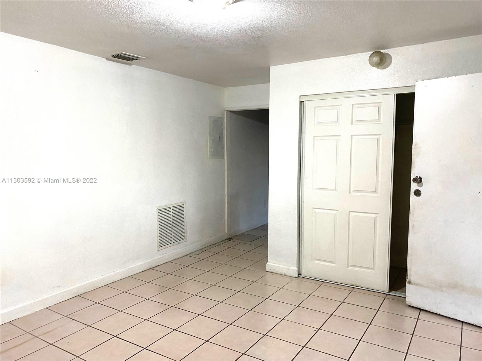 4763 Northwest 3rd Street, Unit 1A Miami, FL 33126 - Photo 5 of 14 a view of an empty room