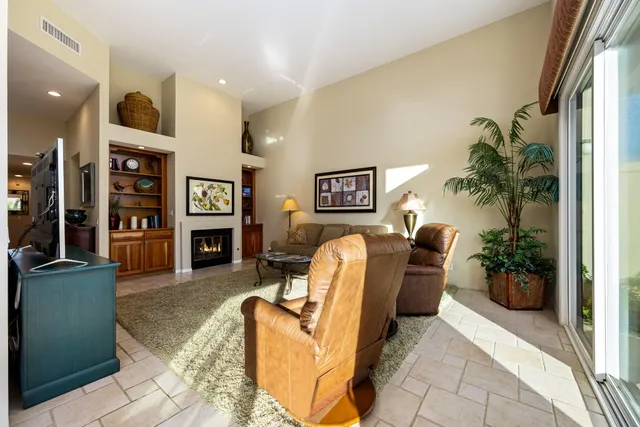 a kitchen with stainless steel appliances granite countertop a refrigerator a stove and a sink