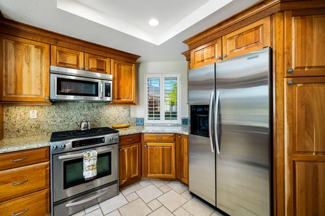 a bedroom with a bed and a night stand