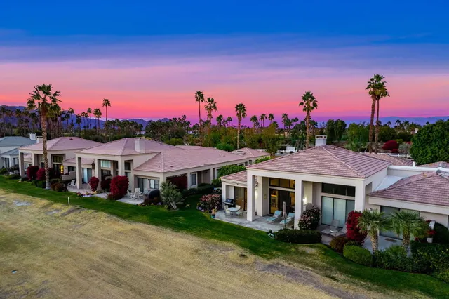 a view of a swimming pool with a yard