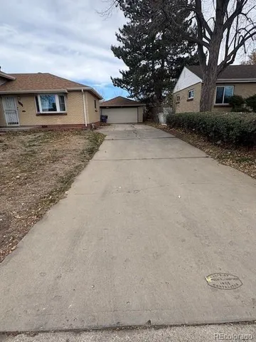 a view of house with yard
