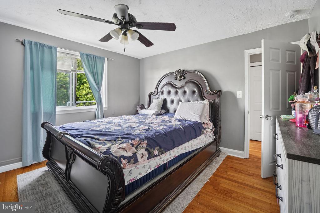 1918 Church Road Baltimore, MD 21222 - Photo 14 of 29 a bedroom with a bed and a chandelier