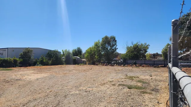 a backyard of a house with large trees