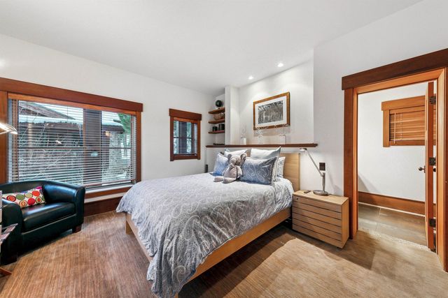 a bedroom with a bed and a couch