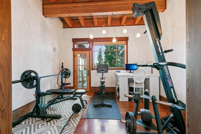 a view of living room with furniture and wooden floor