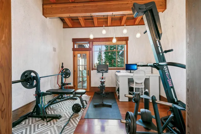 a view of living room with furniture and wooden floor