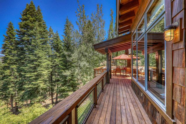 a view of balcony with wooden floor and fence and floor