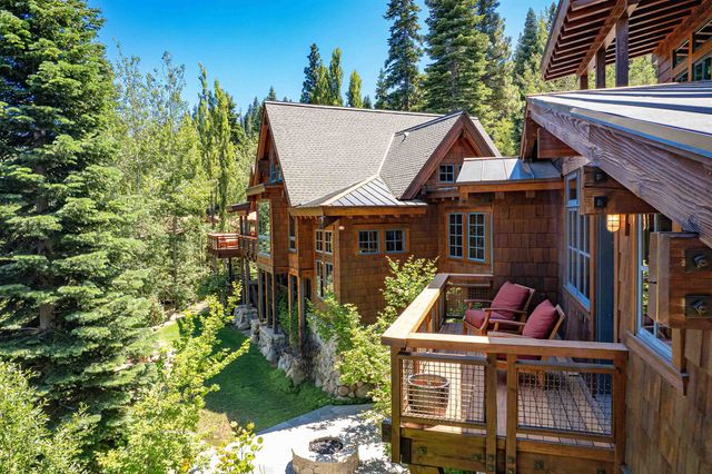 a view of a chairs and table in the balcony