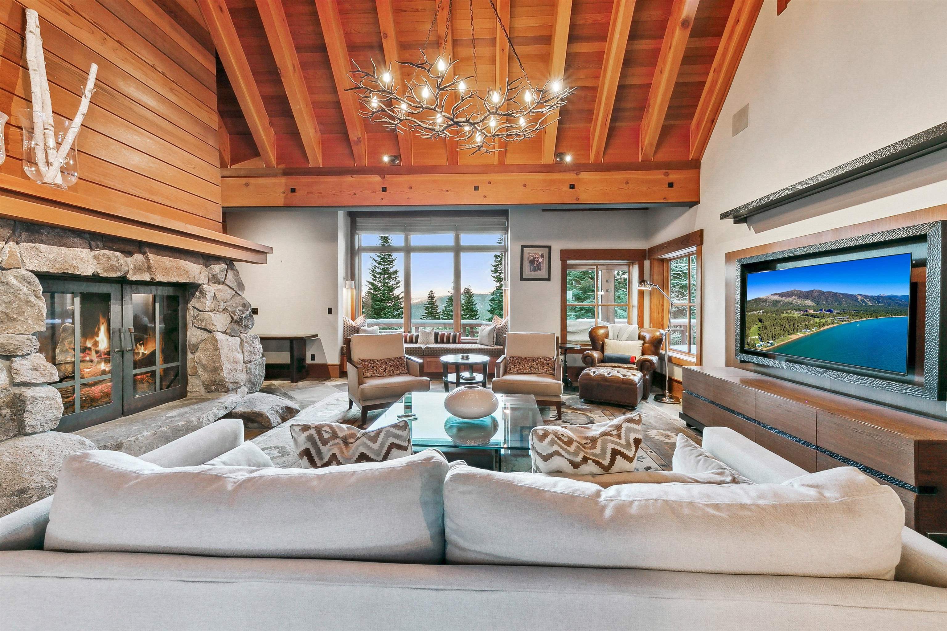2221 Silver Fox Truckee, CA 96161 - Photo 9 of 28 a living room with furniture a fireplace and a flat screen tv