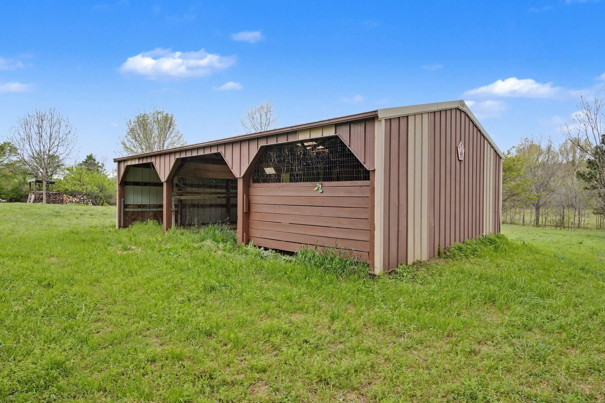 11380 Sycamore Farms Road Collierville, TN 38017 - Photo 34 of 35 View of pole building with a lawn