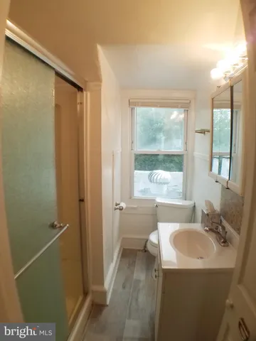 a bathroom with a sink toilet and tub