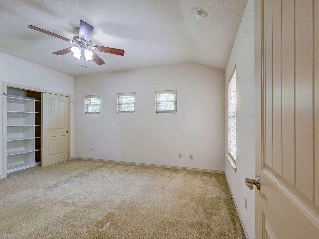 9707 Anderson Mill Road, Unit 22 Austin, TX 78750 - Photo 29 of 39 A versatile room with ample storage and a soaring ceiling provides comfortable living space.