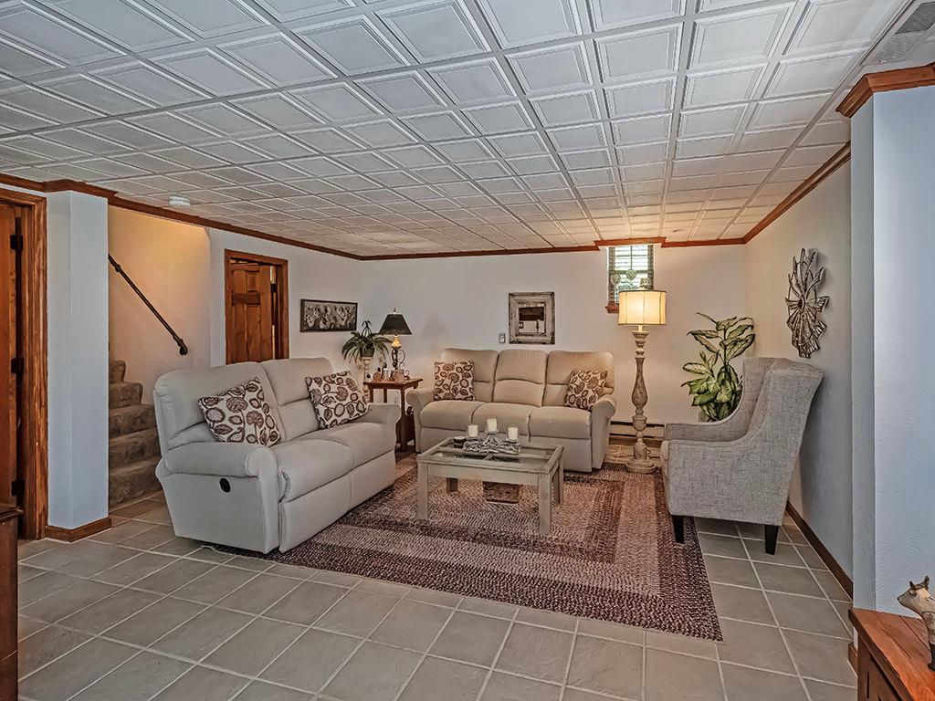 638 Knoll Lane Apollo, PA 15613 - Photo 23 of 30 a living room with furniture and a chandelier
