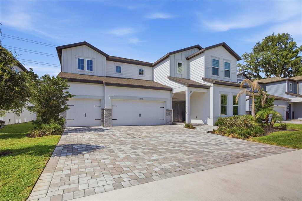 13816 Sharp Hawk Drive Riverview, FL 33569 - Photo 4 of 76 a front view of a house with a yard and garage