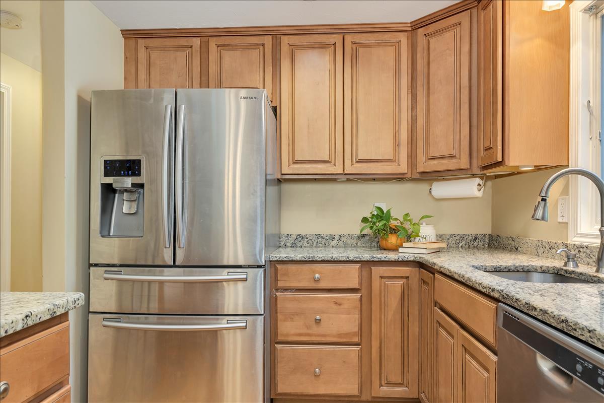 524 Prince Hinckley Road Centerville, MA 02632 - Photo 22 of 43 a kitchen with granite countertop stainless steel appliances a refrigerator and cabinets