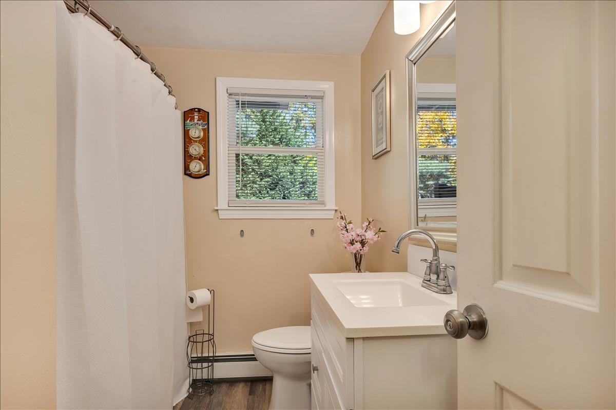 524 Prince Hinckley Road Centerville, MA 02632 - Photo 26 of 43 a bathroom with a sink toilet and a mirror