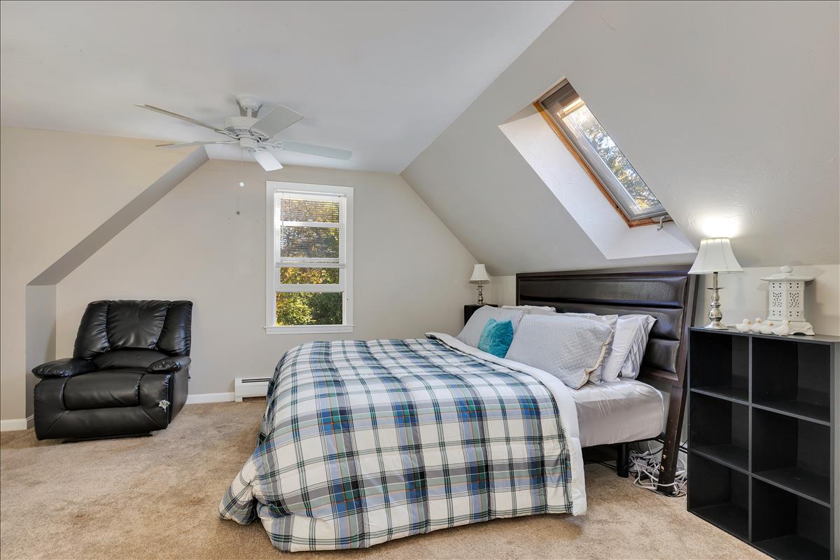 524 Prince Hinckley Road Centerville, MA 02632 - Photo 34 of 43 a bedroom with a bed and wooden floor
