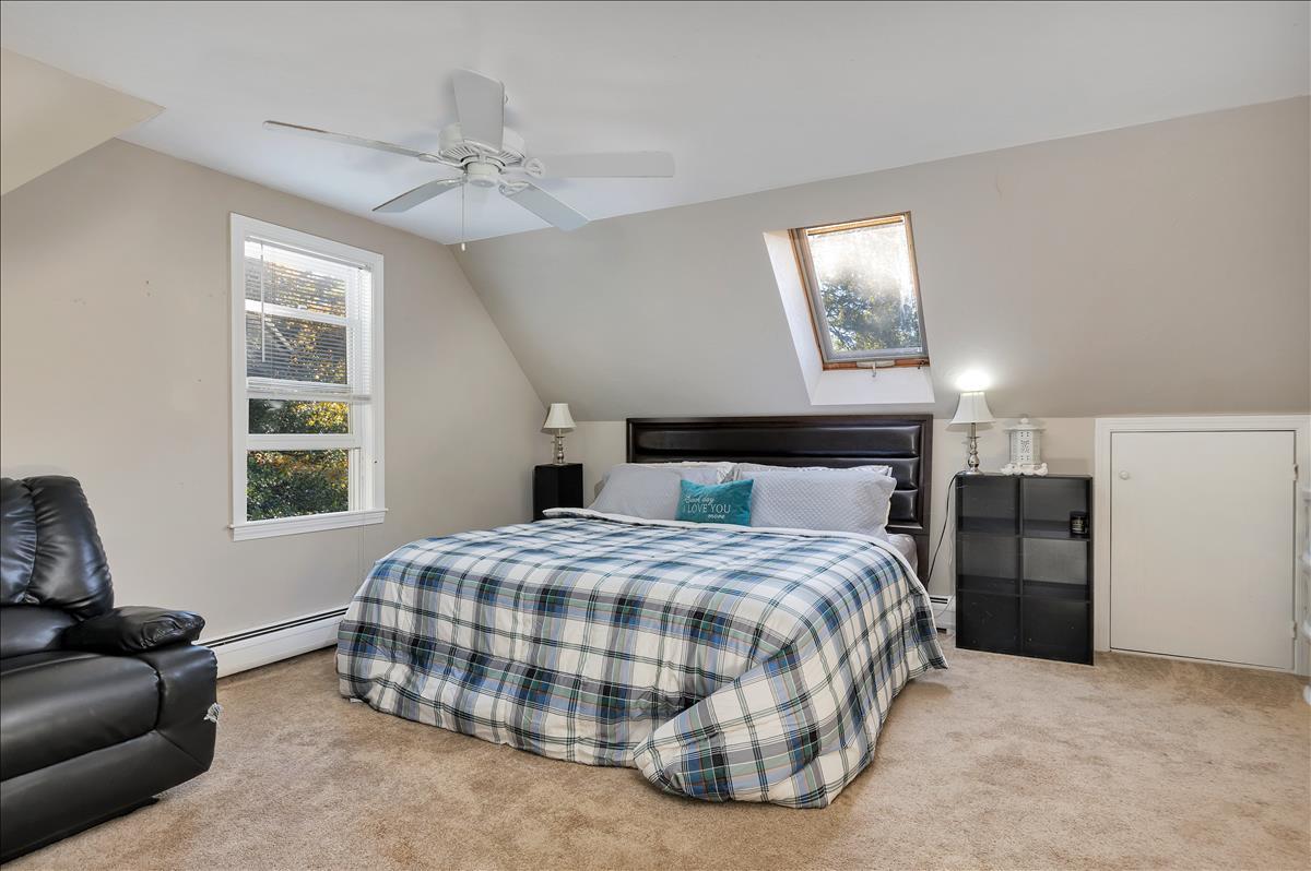 524 Prince Hinckley Road Centerville, MA 02632 - Photo 36 of 43 a bedroom with a bed and a couch