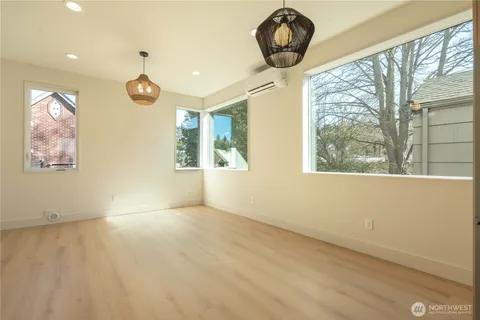 a view of a dining room and a table and chairs